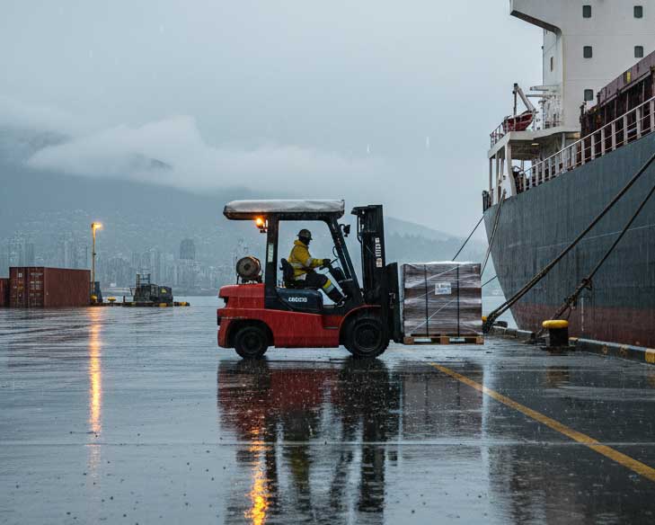 LPG forklift working in rainy Vancouver dock during winter